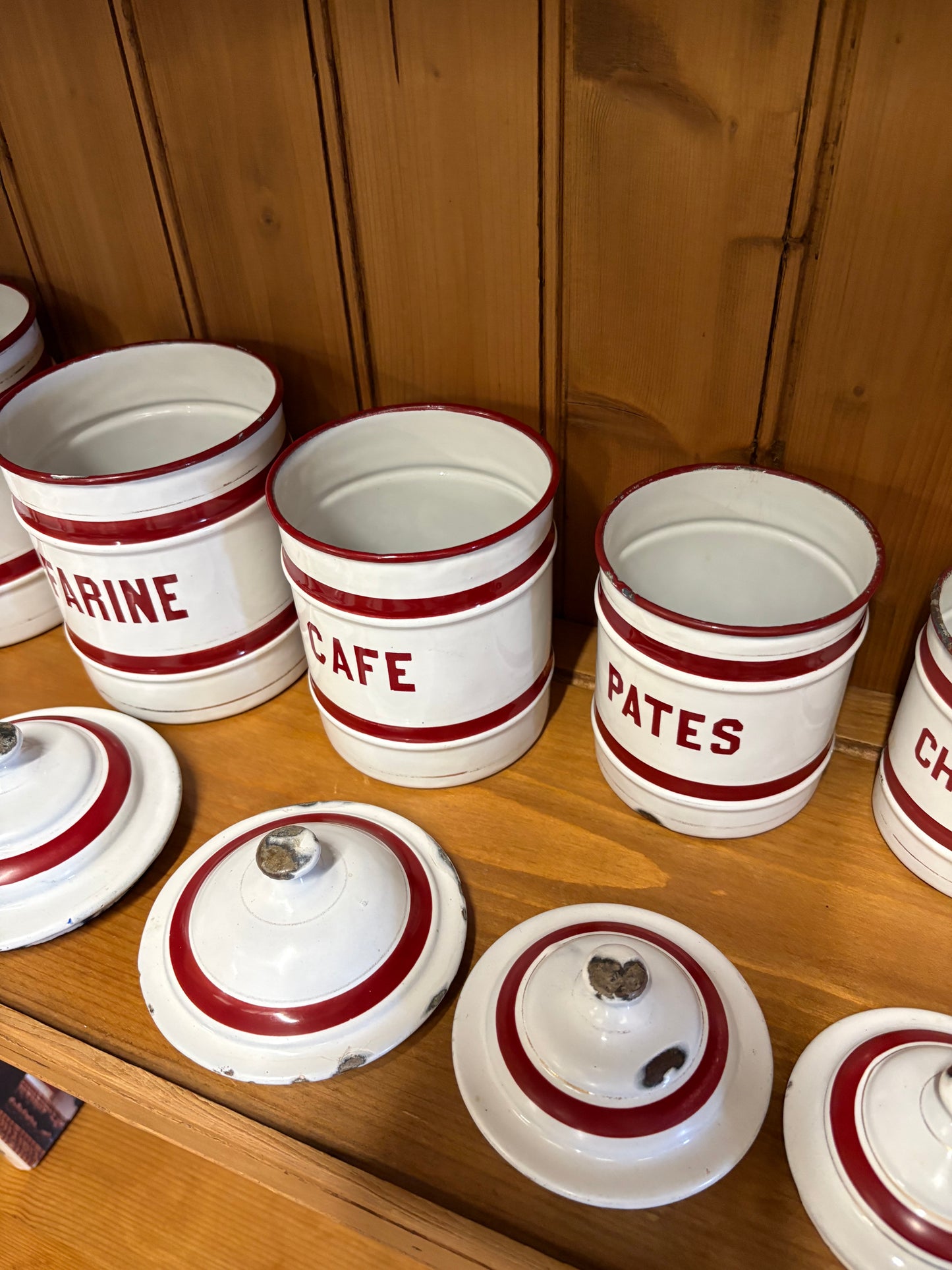 Set of six French Vintage storage canisters, red and white enamel ￼