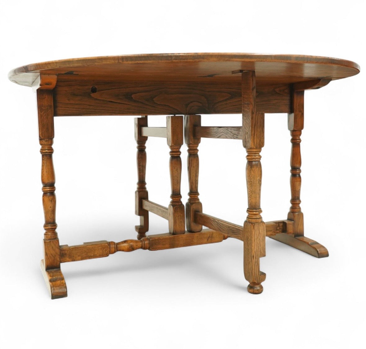 Early 20th century oak gate-leg Dining table - oval top on twin gate turned legs