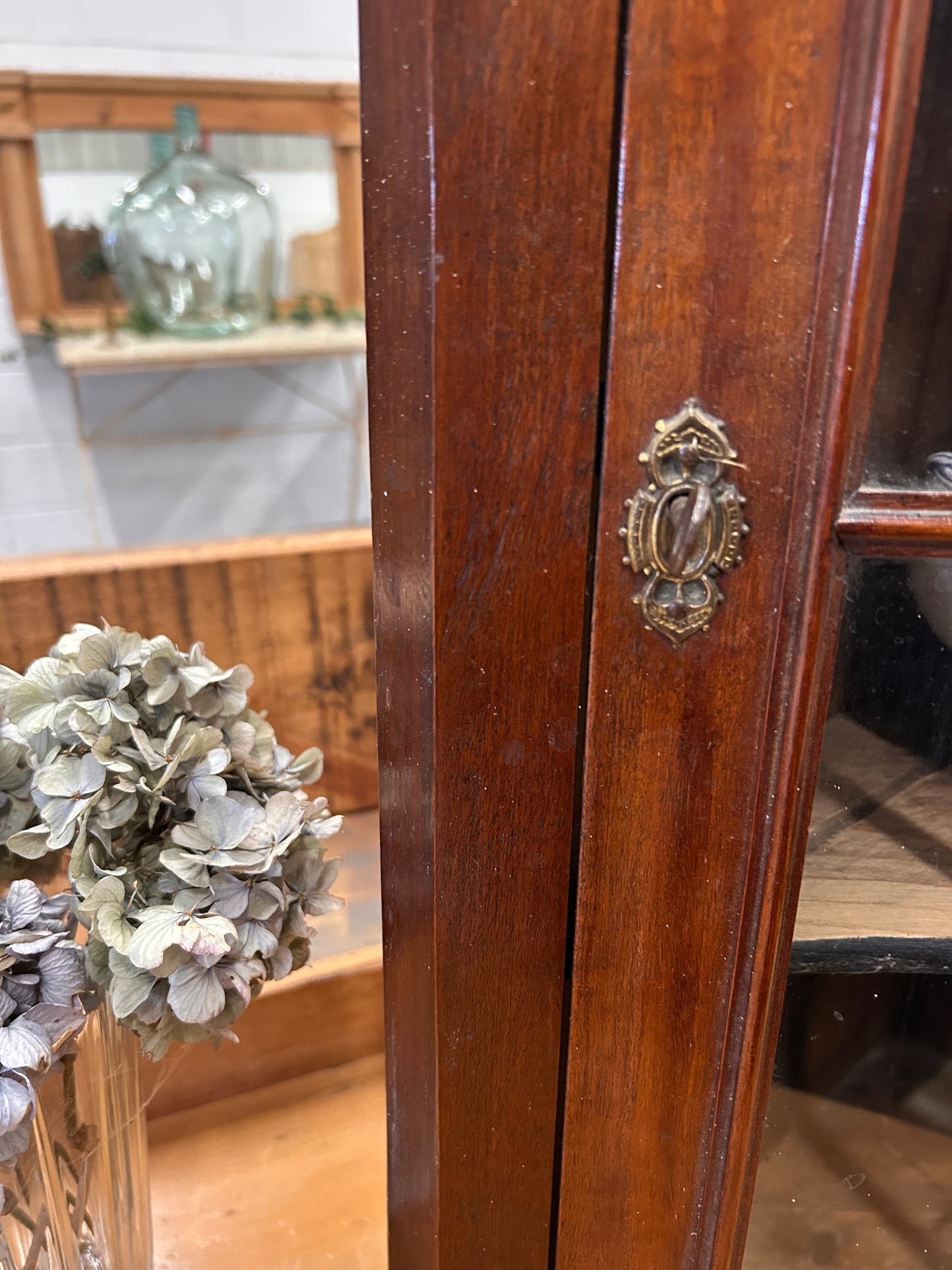 An Edwardian mahogany corner wall cabinet with a glazed front great condition