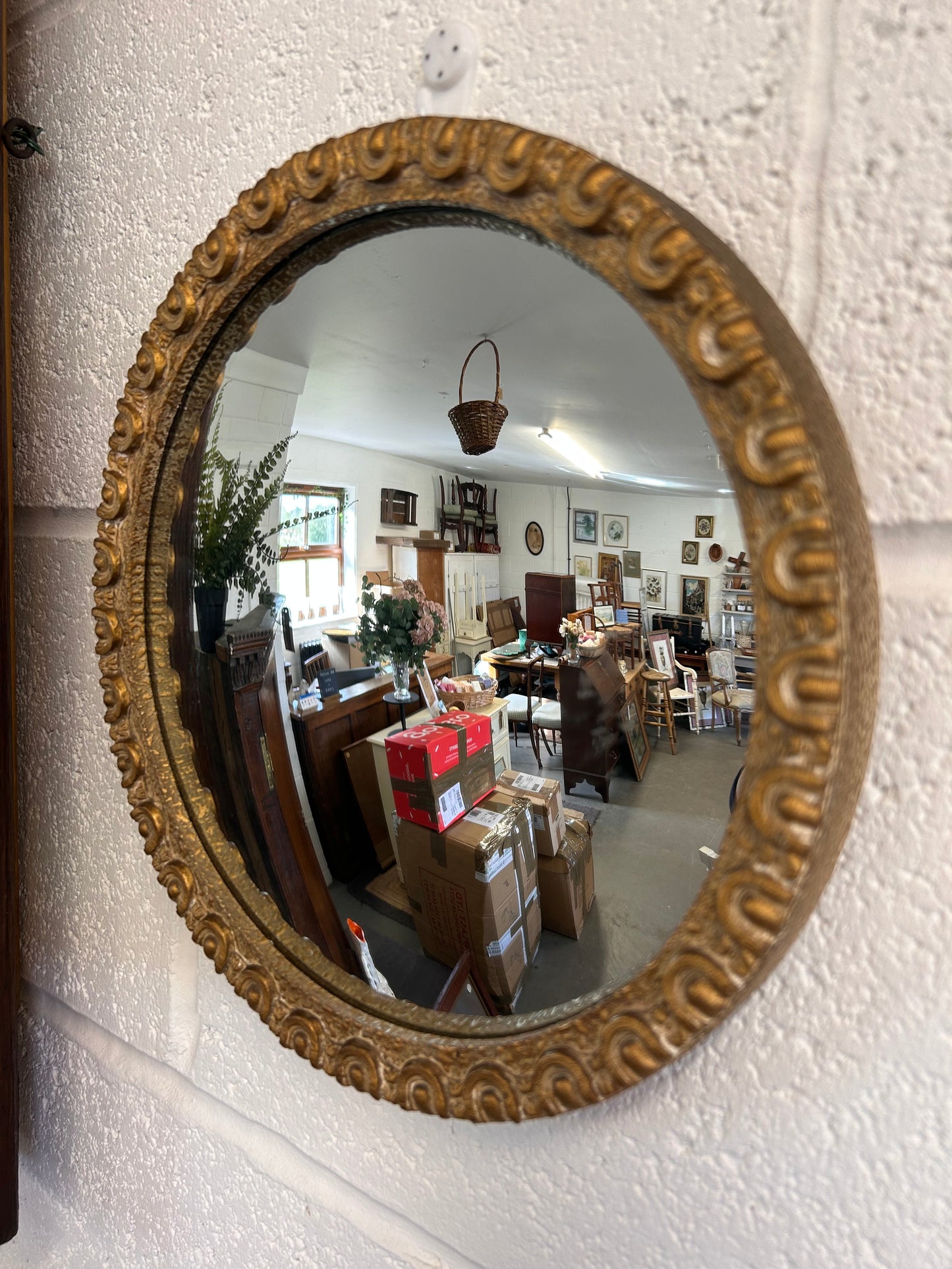 Fabulous circular convex mid-century gilt framed mirror.