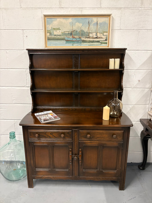 A vintage ERCOL Old Colonial dresser two drawers cupboards plate rack kitchen storage