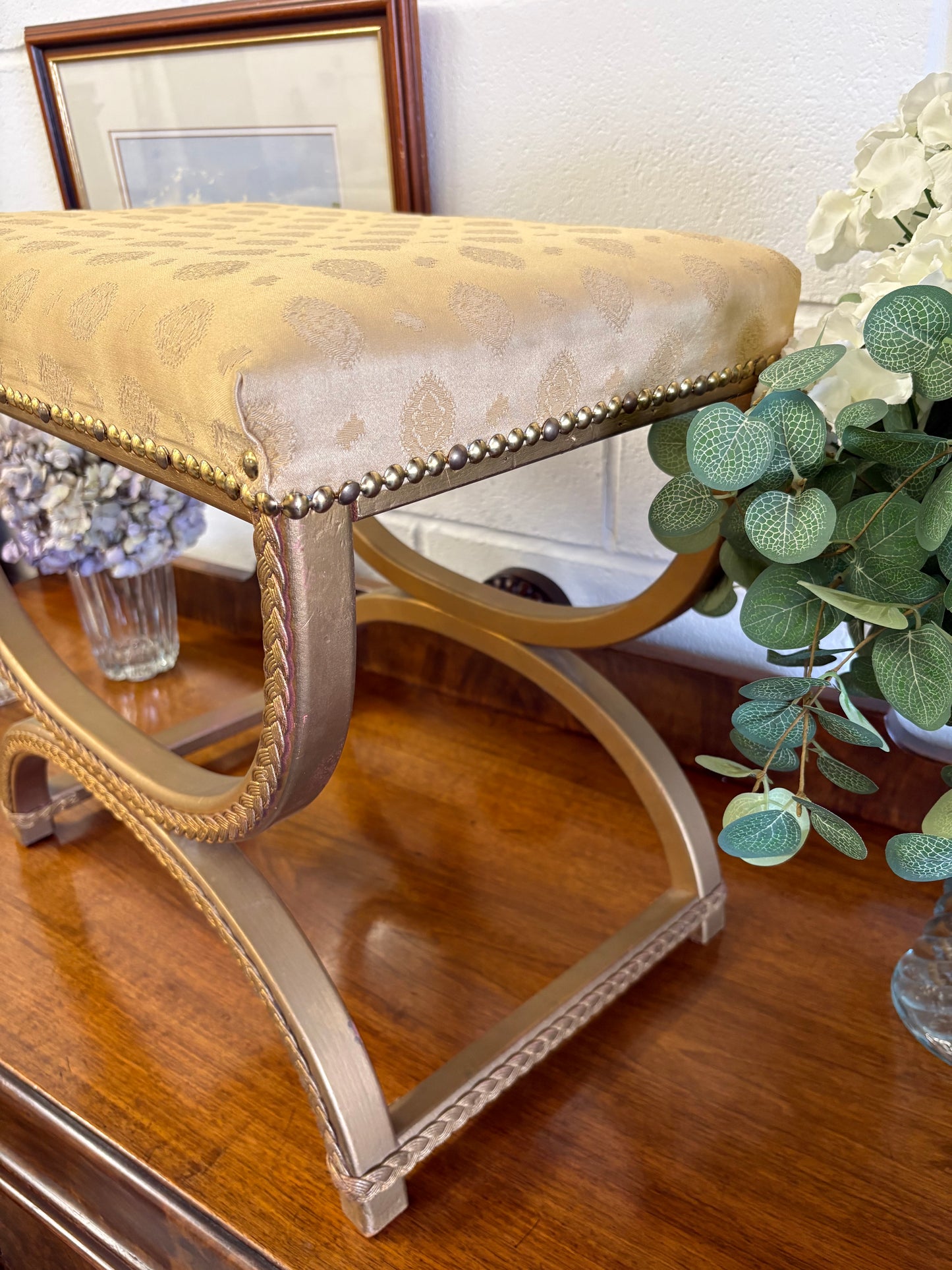 Vintage Regency Yellow Gold upholstered stool with a cross X Frame