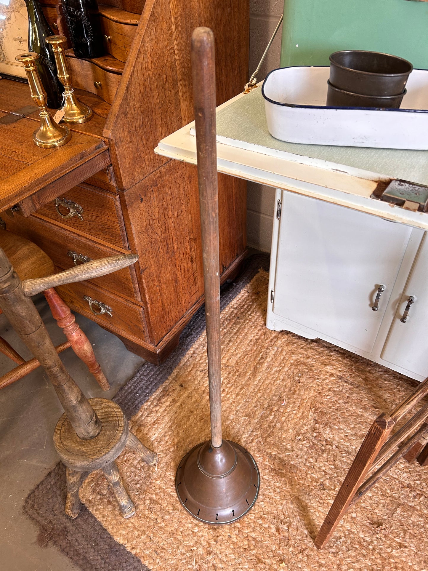 Vintage copper laundry posher great for loo roll storage