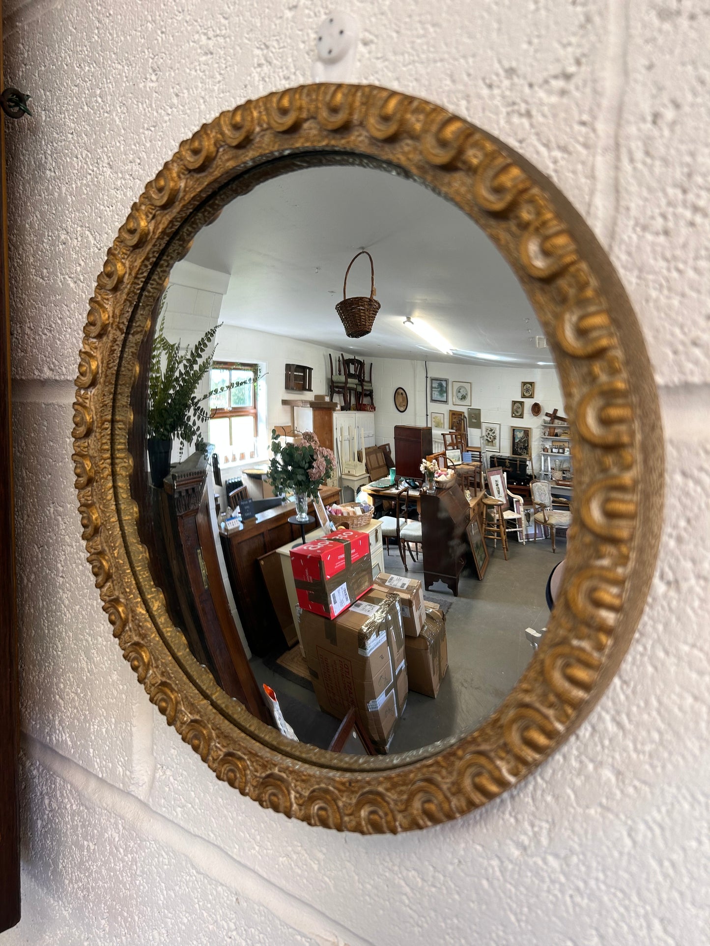 Fabulous circular convex mid-century gilt framed mirror.