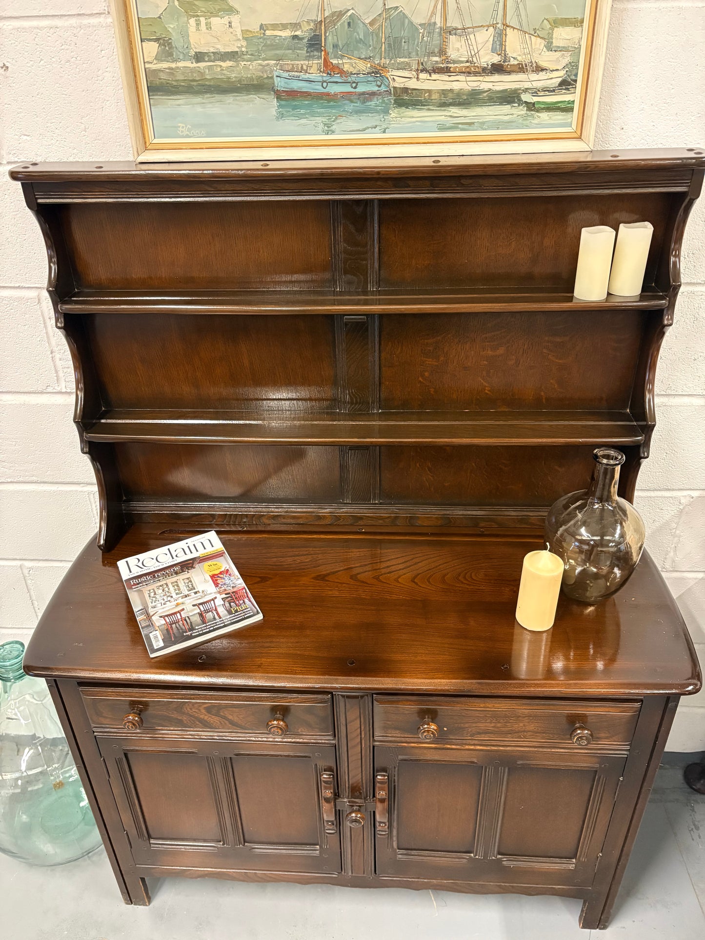 A vintage ERCOL Old Colonial dresser two drawers cupboards plate rack kitchen storage