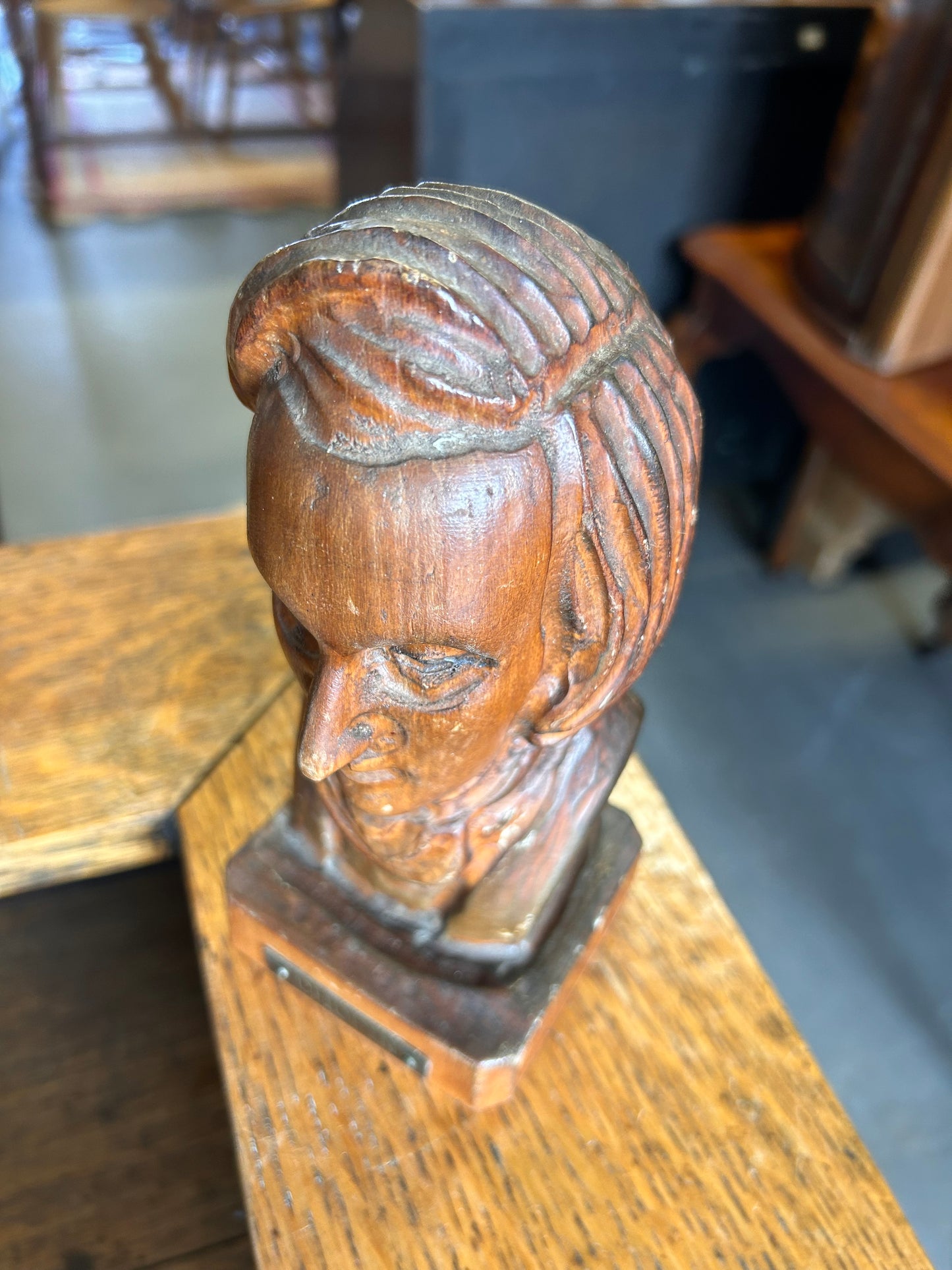 A wooden antique carved bust of the composer Chopin