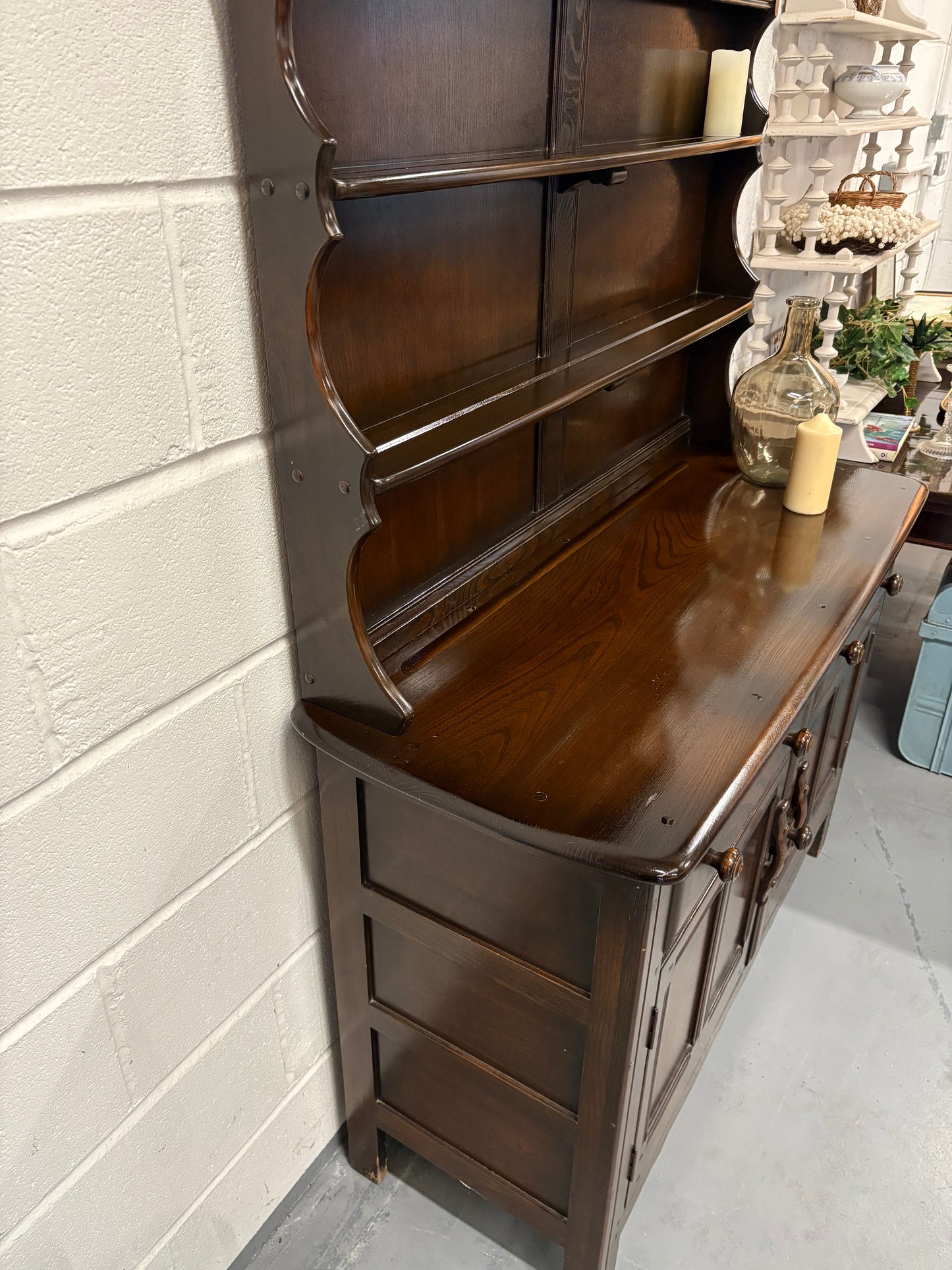 A vintage ERCOL Old Colonial dresser two drawers cupboards plate rack kitchen storage