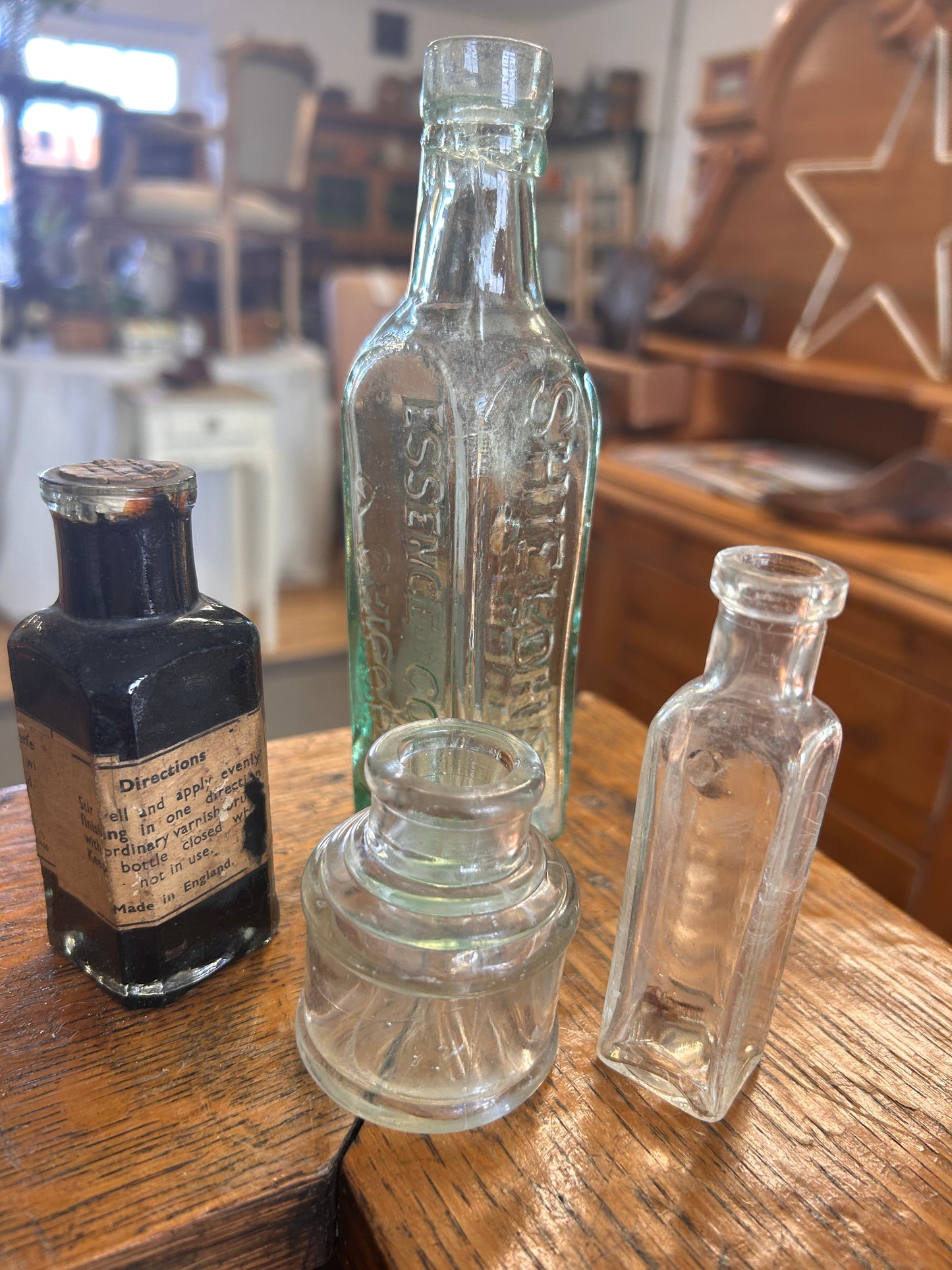 A collection of four vintage original glass bottles for quirky display