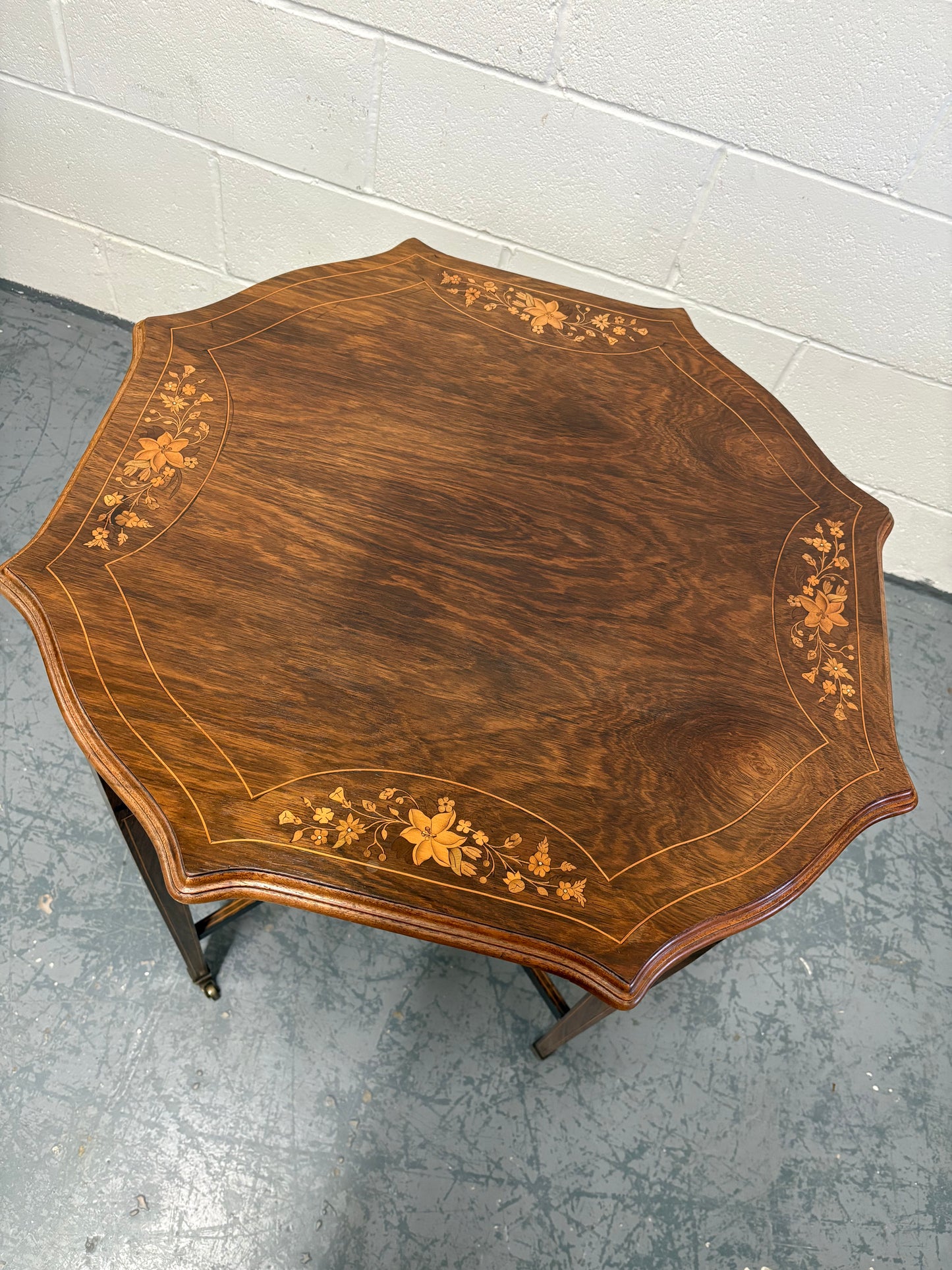 Edwardian inlaid rosewood centre table, octagonal top, square taper legs and undertier