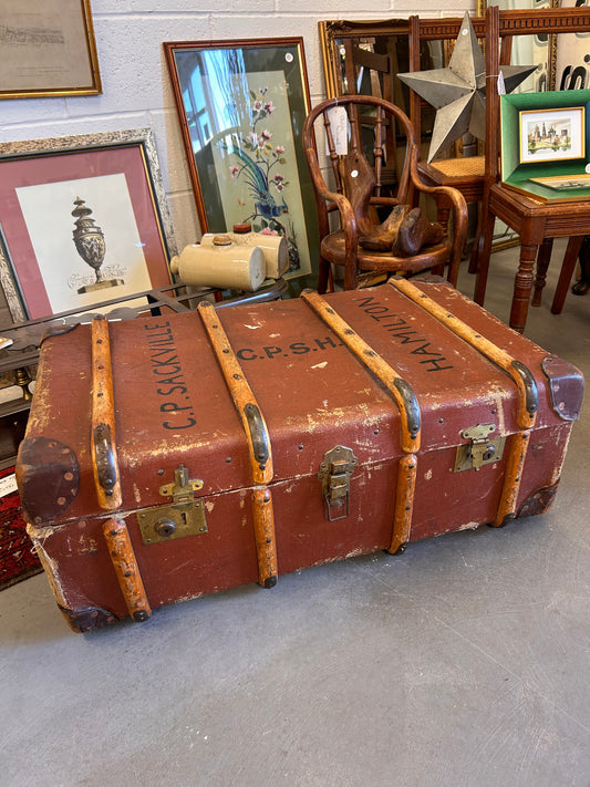 Vintage tan wood banded travel chest steamer trunk.